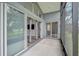 Screened patio provides view of backyard with sliding glass doors to the interior at 4360 85Th Avenue E Cir, Parrish, FL 34219