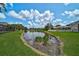 Scenic view of the community pond with lush landscaping and clear blue skies at 4360 85Th Avenue E Cir, Parrish, FL 34219