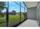 View from the screened patio overlooking the well-maintained backyard and neighboring homes at 4360 85Th Avenue E Cir, Parrish, FL 34219