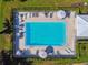 Aerial view of a community pool with ample lounge chairs at 4460 Fairways Blvd # 607, Bradenton, FL 34209