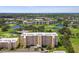 Aerial view of the condo community with lakes, golf courses, and lush greenery at 4460 Fairways Blvd # 607, Bradenton, FL 34209