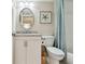 Neat bathroom with granite countertop, framed oval mirror and coordinated decor at 4460 Fairways Blvd # 607, Bradenton, FL 34209