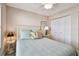 Cozy bedroom featuring a ceiling fan, plush bedding, and ample natural light at 4460 Fairways Blvd # 607, Bradenton, FL 34209