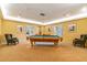 Classic billiard room with pool table, comfortable seating, and natural light at 4460 Fairways Blvd # 607, Bradenton, FL 34209