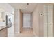 Inviting entryway featuring tile flooring, a closet, and seamless transition into the kitchen at 4460 Fairways Blvd # 607, Bradenton, FL 34209