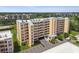 Multi-story condo building with parking and manicured landscaping on a clear day at 4460 Fairways Blvd # 607, Bradenton, FL 34209