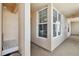 Hallway view with a corner window, a bench, and ceramic tile at 4460 Fairways Blvd # 607, Bradenton, FL 34209