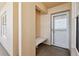 Hallway view showing a window, a bench, and a white front door at 4460 Fairways Blvd # 607, Bradenton, FL 34209