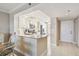 Well-lit kitchen featuring white cabinets, stainless appliances, and granite countertops at 4460 Fairways Blvd # 607, Bradenton, FL 34209