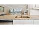 Open concept view from kitchen island into the living area and waterfront at 4460 Fairways Blvd # 607, Bradenton, FL 34209