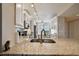 Spacious kitchen featuring stainless steel appliances, granite countertops, and overhead lighting at 4460 Fairways Blvd # 607, Bradenton, FL 34209