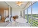 Spacious tiled lanai with seating provides views of the golf course, pond and the home's interior at 4460 Fairways Blvd # 607, Bradenton, FL 34209