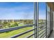 Serene screened lanai with views of the golf course, pond, and community buildings at 4460 Fairways Blvd # 607, Bradenton, FL 34209