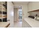 Bright laundry room with a washer and dryer, tile floor, and plenty of storage at 4460 Fairways Blvd # 607, Bradenton, FL 34209