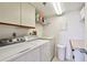 Dedicated laundry area with washer, dryer, and storage at 4460 Fairways Blvd # 607, Bradenton, FL 34209