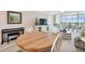 Living and dining area with table and comfortable seating near the view of the balcony at 4460 Fairways Blvd # 607, Bradenton, FL 34209