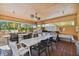 Outdoor kitchen with built-in grill, seating area and perfect for entertaining guests at 4460 Fairways Blvd # 607, Bradenton, FL 34209