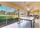 Enclosed patio with ping pong table and seating area, perfect for recreation and relaxation at 4460 Fairways Blvd # 607, Bradenton, FL 34209