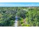 Aerial view of a walking path through a lush green community at 4487 Cinnamon Dr # 2604, Sarasota, FL 34238