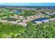 Wide aerial shot showcases the community with serene lakes and lush greenery at 4487 Cinnamon Dr # 2604, Sarasota, FL 34238