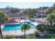 Overhead view of the community pool with ample seating and amenities at 4487 Cinnamon Dr # 2604, Sarasota, FL 34238