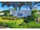 Elegant community sign nestled amongst manicured landscaping at 4487 Cinnamon Dr # 2604, Sarasota, FL 34238