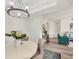 Bright dining area with chandelier, luxury vinyl plank flooring, and access to the living area at 4487 Cinnamon Dr # 2604, Sarasota, FL 34238