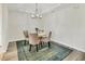 Bright dining area with chandelier, and luxury vinyl plank flooring at 4487 Cinnamon Dr # 2604, Sarasota, FL 34238