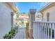 Brick paver walkway leading to the front door through a private gated entrance at 4487 Cinnamon Dr # 2604, Sarasota, FL 34238