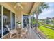 Inviting screened lanai with outdoor seating and scenic lake views at 4487 Cinnamon Dr # 2604, Sarasota, FL 34238