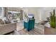 Bright and airy living room featuring modern decor, luxury vinyl plank flooring, and sliding glass doors at 4487 Cinnamon Dr # 2604, Sarasota, FL 34238
