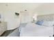 Bright and airy main bedroom with a tufted headboard and plenty of natural light at 4487 Cinnamon Dr # 2604, Sarasota, FL 34238