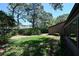 Backyard featuring lush lawn and mature landscaping for privacy and shade at 4555 Chandlers Forde # 47, Sarasota, FL 34235