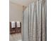 Bathroom features decorative shower curtain and towel racks for a clean and organized space at 4555 Chandlers Forde # 47, Sarasota, FL 34235
