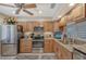 Well-equipped kitchen with stainless steel appliances and granite countertops for a modern culinary experience at 4555 Chandlers Forde # 47, Sarasota, FL 34235
