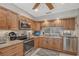 Kitchen featuring modern stainless steel appliances, granite countertops, and custom cabinetry for cooking convenience at 4555 Chandlers Forde # 47, Sarasota, FL 34235