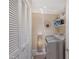 Convenient laundry room featuring a washer, shelves, and ample storage space at 4555 Chandlers Forde # 47, Sarasota, FL 34235