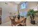 Bright breakfast nook with tall windows and tile floors at 4555 Chandlers Forde # 47, Sarasota, FL 34235
