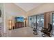 Living room featuring a flat-screen TV and sliding doors to an outdoor patio, perfect for relaxation at 4555 Chandlers Forde # 47, Sarasota, FL 34235