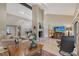 Bright living room showcasing high ceilings, fireplace, and a flat-screen TV for ultimate relaxation and entertainment at 4555 Chandlers Forde # 47, Sarasota, FL 34235