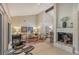 Inviting living room with a fireplace and comfortable seating, complemented by neutral tones and elegant decor at 4555 Chandlers Forde # 47, Sarasota, FL 34235