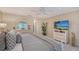 Main bedroom showcasing ample space, neutral decor, and a flat-screen TV for relaxation and entertainment at 4555 Chandlers Forde # 47, Sarasota, FL 34235