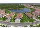 Aerial shot showcases property, lake view, and surrounding community at 460 Daylily Blvd, Nokomis, FL 34275