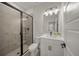 Contemporary bathroom features a shower with matte black trim and a vanity with a white countertop at 460 Daylily Blvd, Nokomis, FL 34275