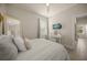 Bright bedroom featuring a ceiling fan, tv, and natural light at 460 Daylily Blvd, Nokomis, FL 34275