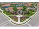 Aerial view of the clubhouse surrounded by landscaping and greenery at 460 Daylily Blvd, Nokomis, FL 34275