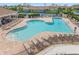 Resort-style community pool with ample seating and lounge chairs at 460 Daylily Blvd, Nokomis, FL 34275