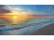 Picturesque sunset over the ocean, with vibrant colors reflecting on the calm water and sandy beach at 460 Daylily Blvd, Nokomis, FL 34275