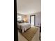 Bright bedroom features a comfy bed and a convenient entrance/exit door at 4945 Camphor Ave, Sarasota, FL 34231