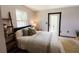 Comfortable bedroom featuring a cozy bed, stylish decor, and a view to the outside at 4945 Camphor Ave, Sarasota, FL 34231
